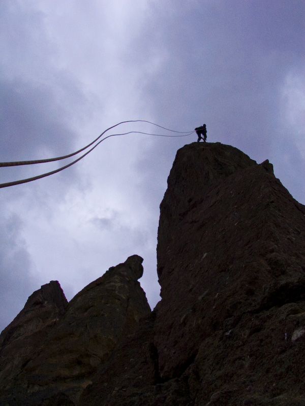 Climber Rappelling Skyline Ridge In High Wind